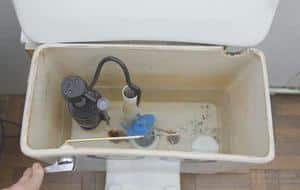 Empty water tank before installing handheld bidet