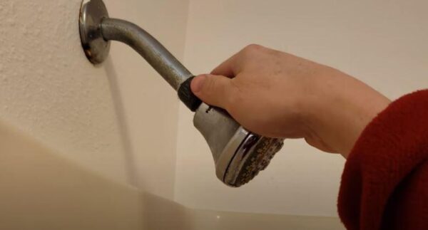 put off shower head carefully to clean